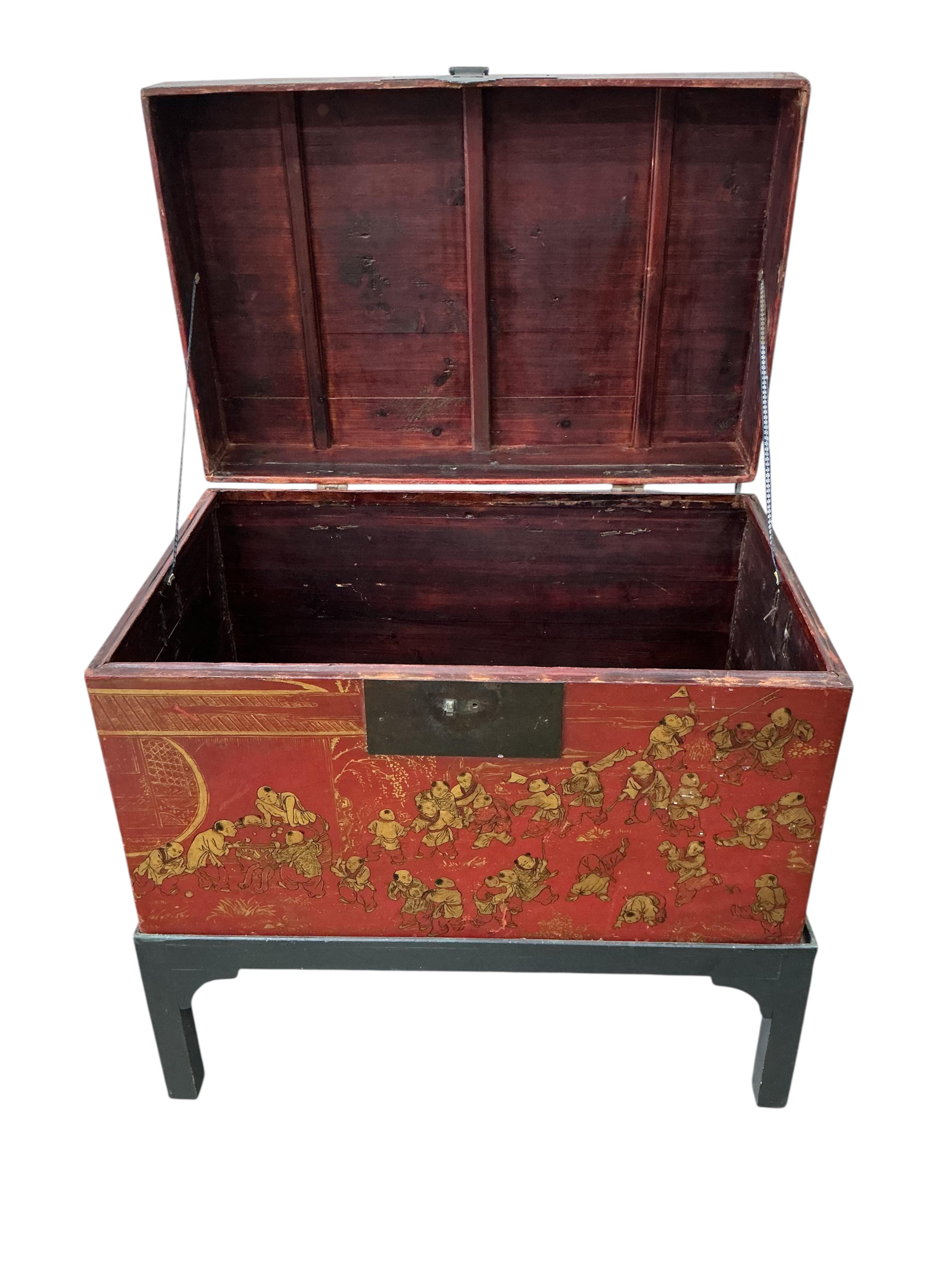A Chinese scarlet lacquer trunk on stand, width 83cm, depth 53cm, height 84cm